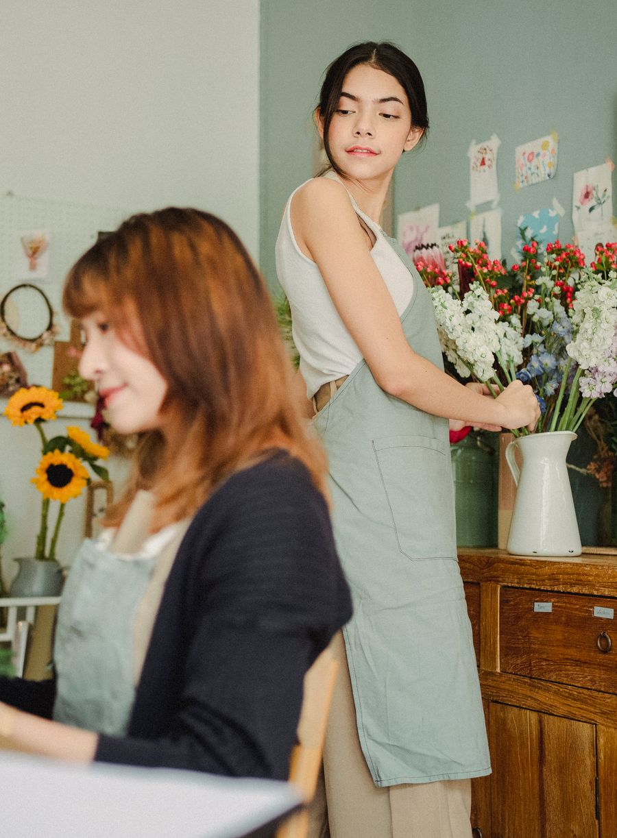 Florist composing a bouquet in the Opulent Flora atelier