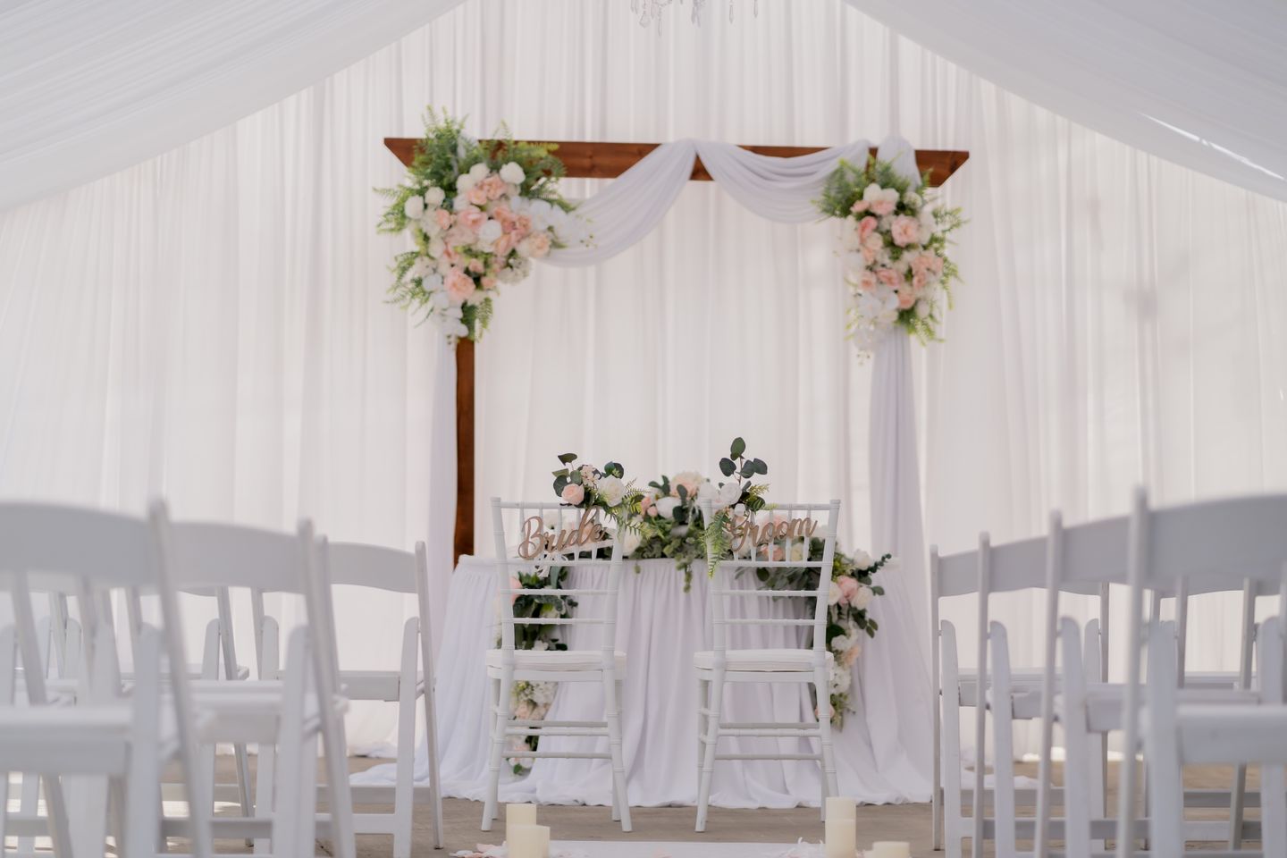 Elegant wedding floral arch and table styling